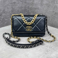 Chanel Classic Flap mini da lambskin màu đen dây xích mix vàng – bạc